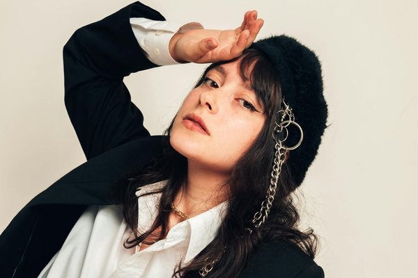 How to Coordinate a Polka Dot Blouse with Striped Trousers Without Overpowering?